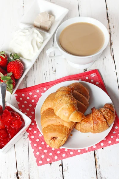 Breakfast with croissants, strawberry  and cup of coffe on white — Stock Photo, Image