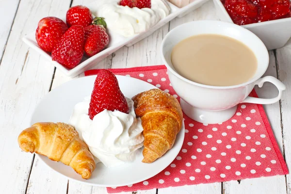 Breakfast with croissants, strawberry  and cup of coffe on white — Stock Photo, Image