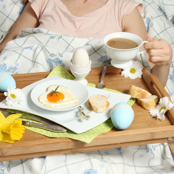 Tray with breakfast on a bed — Stock Photo, Image