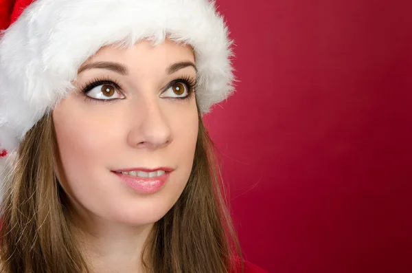 Weihnachtsmann Frau schaut auf — Stockfoto