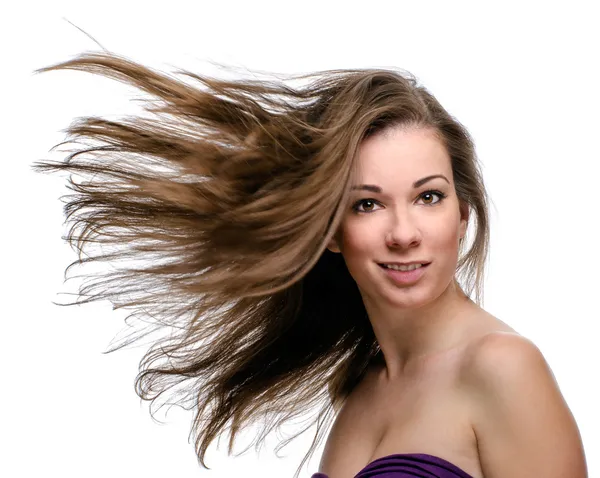 Attraktive Frau mit fliegenden langen Haaren Stockfoto