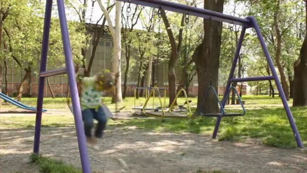 Child on swing — Stock Video