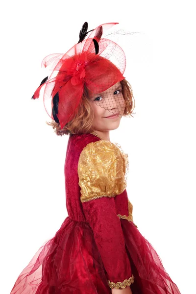 Kleines Mädchen im goldenen und roten Kleid posiert — Stockfoto