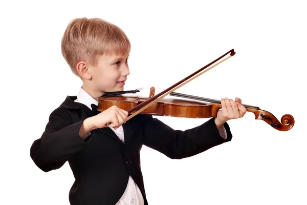Boy in tuxedo play violin Stockfoto