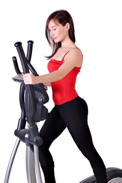 Girl fitness exercise cross trainer — Stock Photo, Image