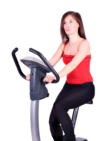 Flicka cross trainer motion — Stockfoto