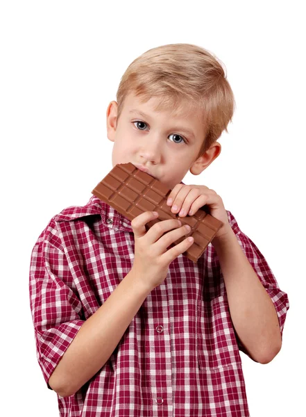 Boy eat chocolate on white — Stock Photo, Image