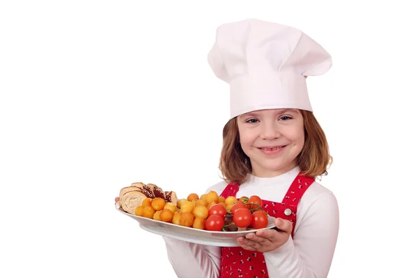 Klein meisje koken met gastronomische gerechten — Stockfoto