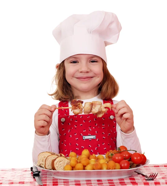 Little girl cook eat grilled chicken meat — Stock Photo, Image