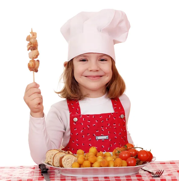 Happy little girl cook with grilled chicken meat — Stock Photo, Image