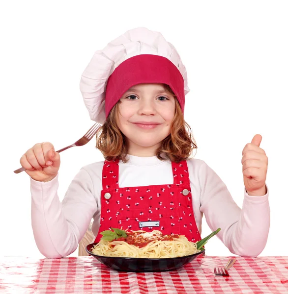 Happy little girl cook with spaghetti — Stock Photo, Image