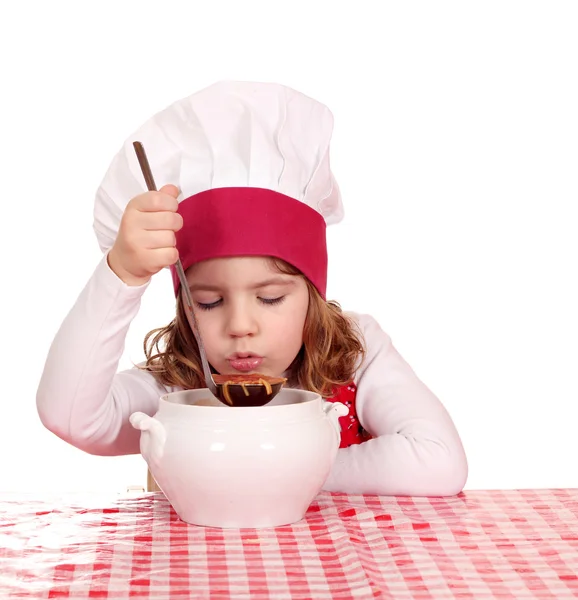 Little girl cook taste soup — Stock Photo, Image