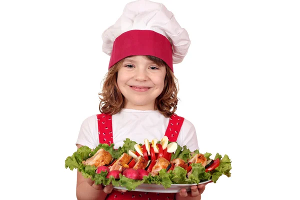 Hermosa niña cocinera con comida gourmet —  Fotos de Stock