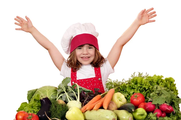 Glad liten flicka koka med grönsaker — Stockfoto