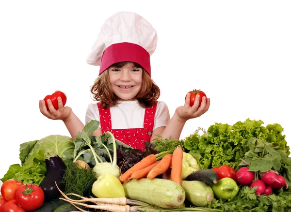Weinig meisje kok met groenten — Stockfoto