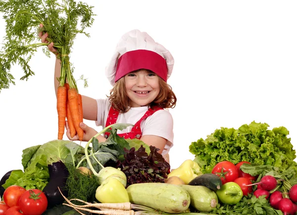 Happy little girl cook holding carrot — Stock Photo, Image