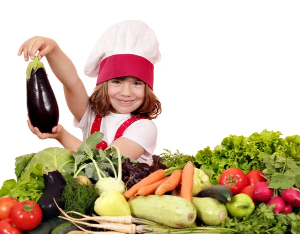 Little girl cook holding aubergine — Stock Photo, Image