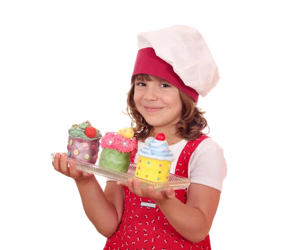 Niña feliz con cupcakes — Foto de Stock