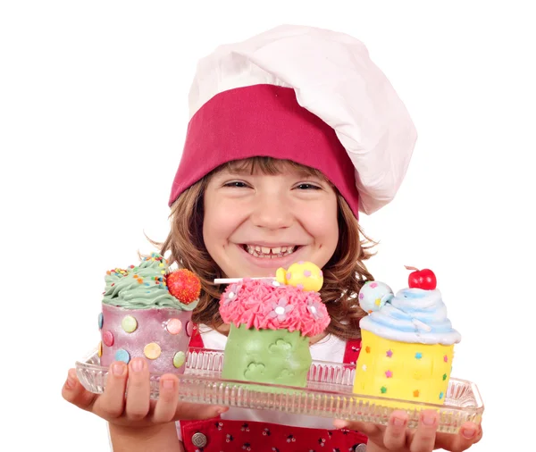 Happy little girl cook with sweet cupcakes — Stock Photo, Image