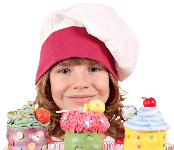 Petite fille cuisinier avec cupcakes portrait — Photo