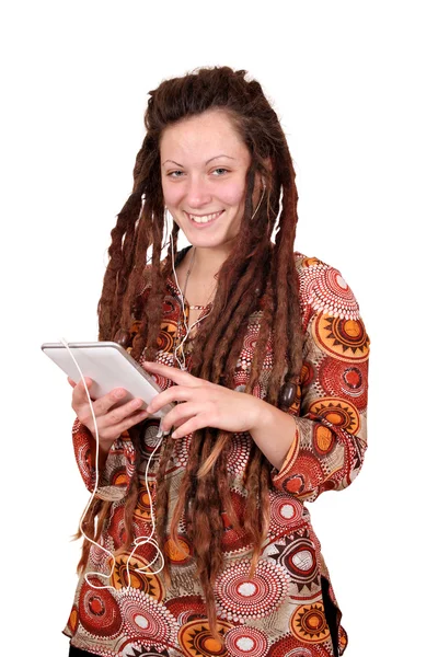 Happy girl with dreadlocks hair listening music on tablet — Stock Photo, Image