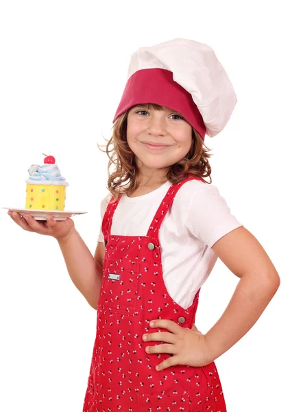 Menina feliz cozinhar com doce cupcake colorido — Fotografia de Stock