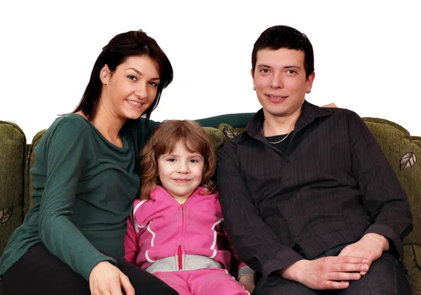 Familia feliz sentado en el sofá — Foto de Stock