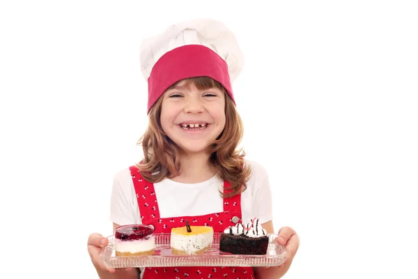 Happy little girl cook with cakes — Stock Photo, Image