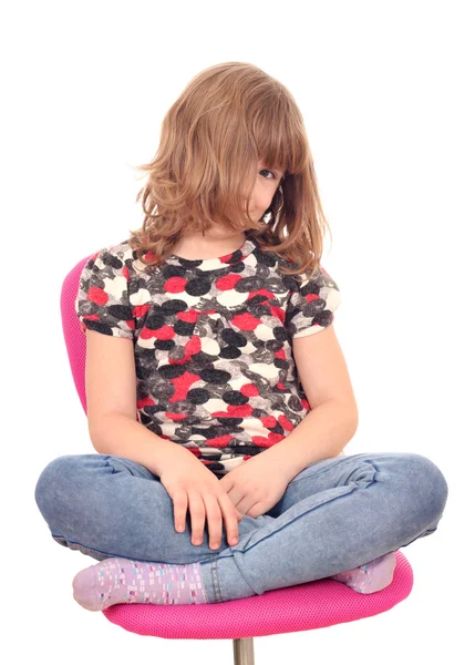 Beautiful little girl sitting on chair — Stock Photo, Image