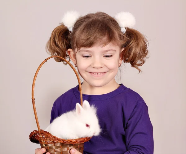 Happy little girl hold white bunny — Stock Photo, Image