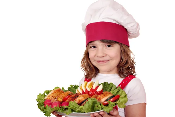 Маленькая девочка готовить с изысканной пищевой портрет — стоковое фото