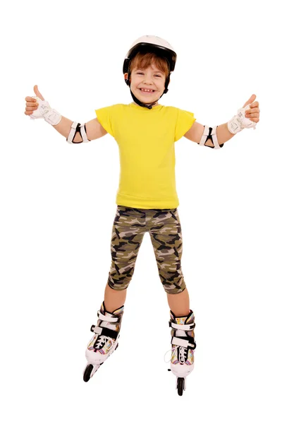 Маленька дівчинка з роликовими ковзанами і великими пальцями вгору — стокове фото