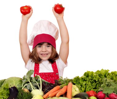 mutlu küçük kız yemek sebze ve domates ile