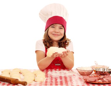 happy little girl cook with dough clipart