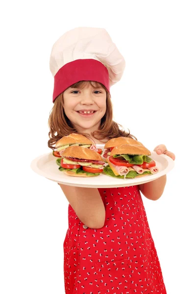 Niña feliz cocinero con sándwiches — Foto de Stock