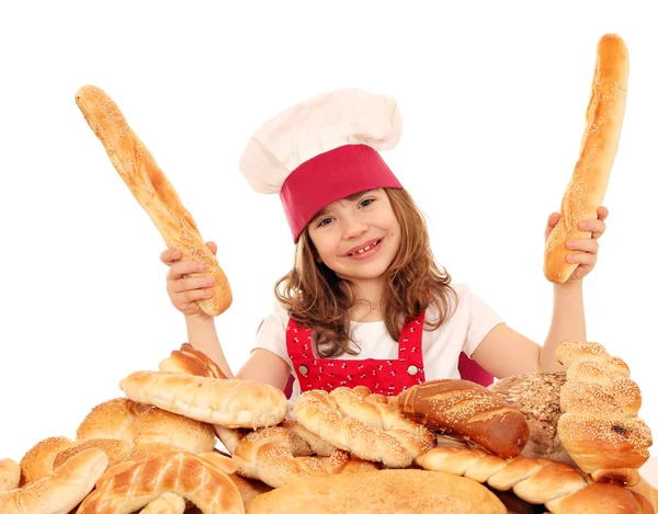 Happy little girl bakery with breads — Stock Photo, Image