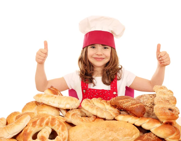 Padaria menina com polegares para cima e pães — Fotografia de Stock