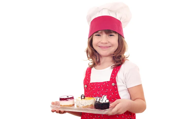 Hermosa niña con pasteles — Foto de Stock