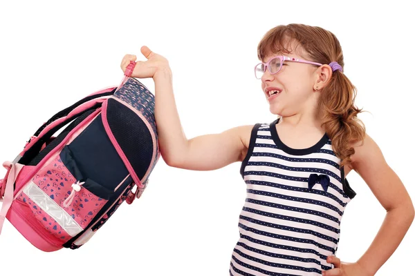 Klein meisje probeert op te heffen zware Schooltasje — Stockfoto