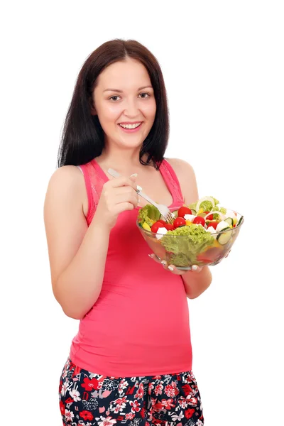 Beautiful teenage girl eating salad — Stock Photo, Image