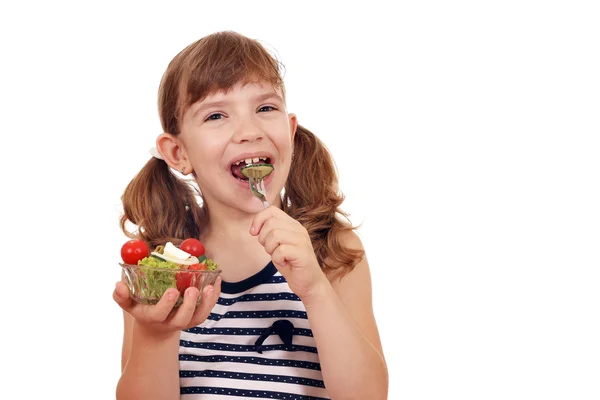 Happy little girl eating salad — Stock Photo, Image