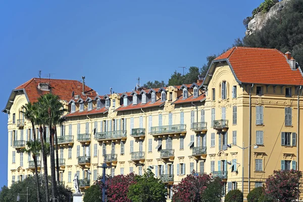 old building and palm trees in Nice France