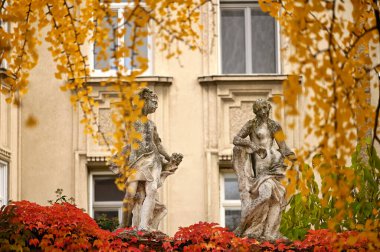 old statues in park Vienna autumn season