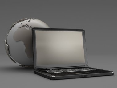 Laptop and earth globe on gray background