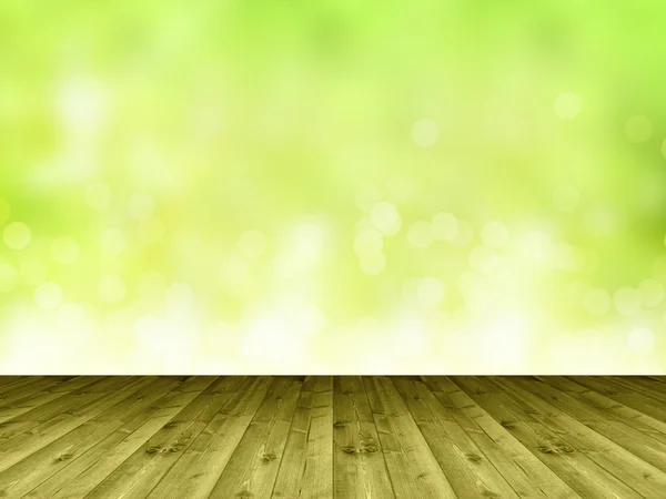 Fából készült padló és homályos zöld háttér mint egy fal — Stock Fotó