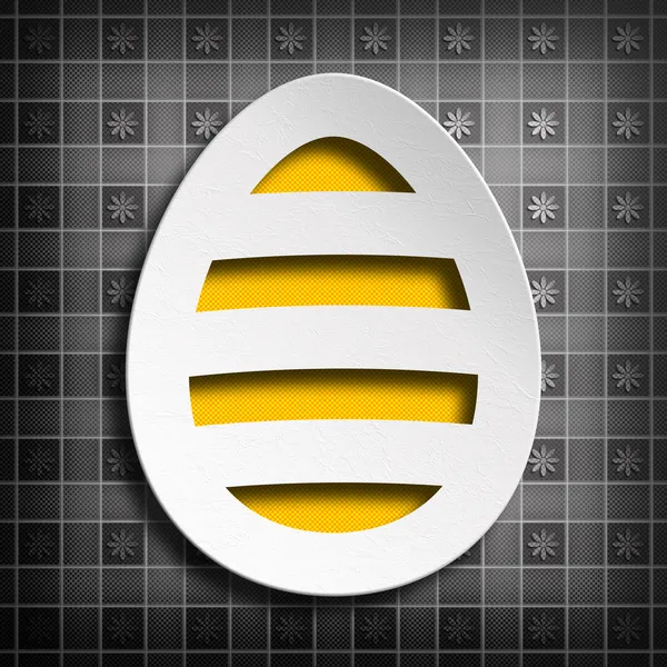 Tvar velikonoční vajíčko na šedé vzorované pozadí — Stock fotografie