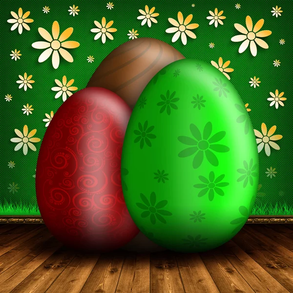 Tres huevos de Pascua de colores sobre fondo verde —  Fotos de Stock