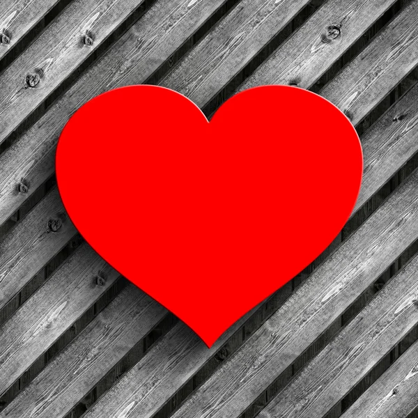 Corazón rojo sobre tablones de madera fondo — Foto de Stock