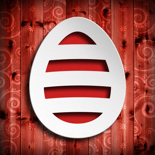 Shape of Easter egg on red wooden background — Stock Photo, Image