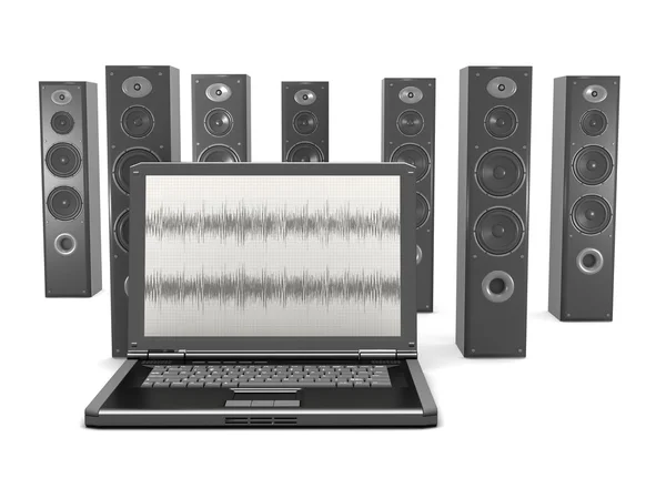Laptop and audio speakers in background — Stock Photo, Image